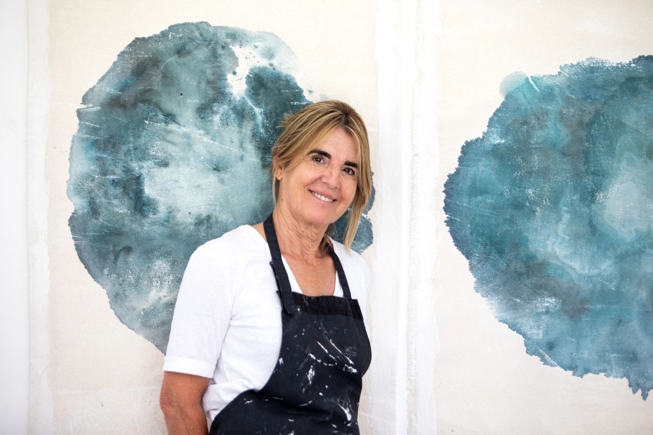 Creative studio owner standing proudly in her workshop
